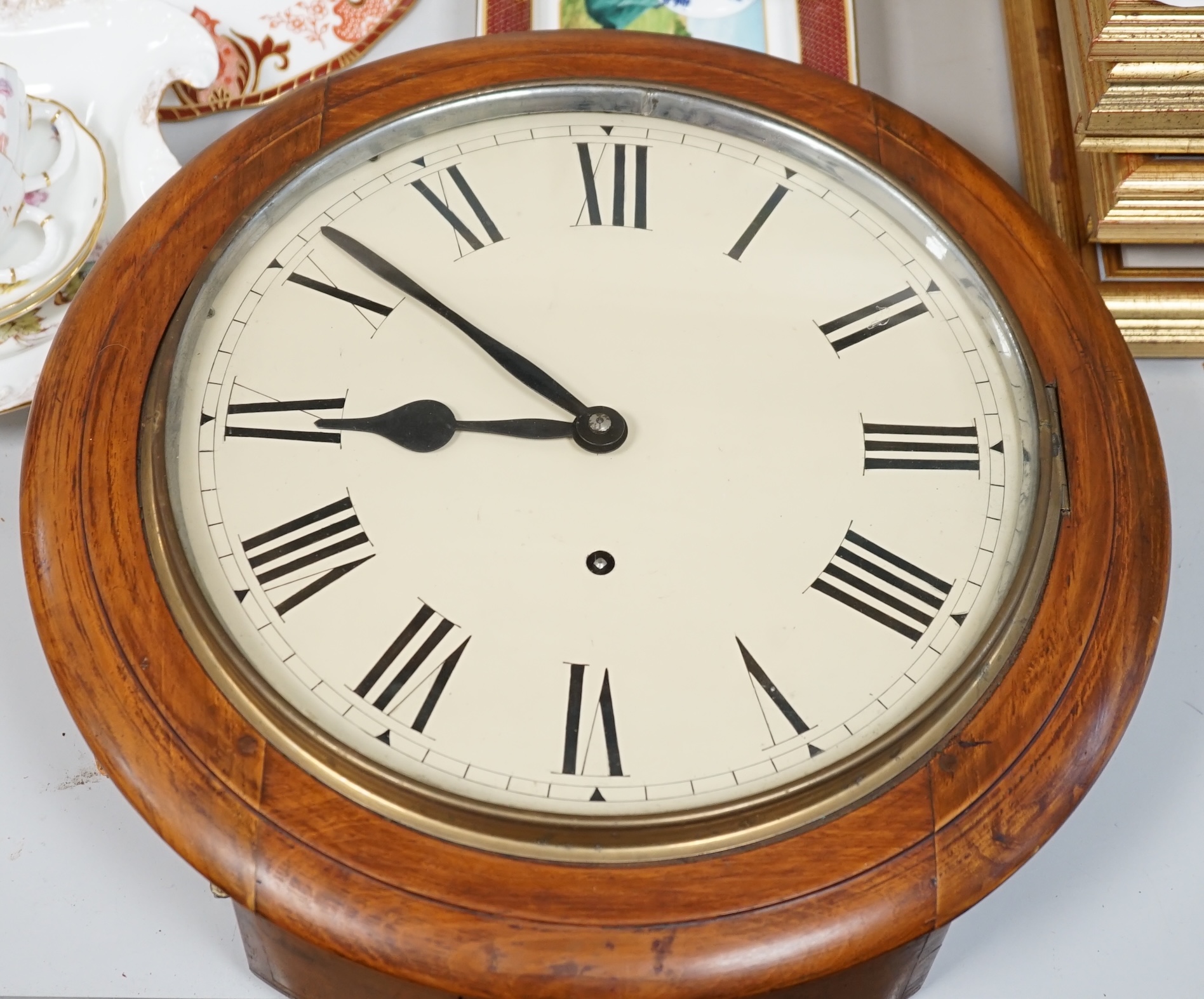 A Victorian mahogany circular dial eight day wall timepiece, with a spring driven movement and a white enamelled dial with Roman numerals, diameter 40cm